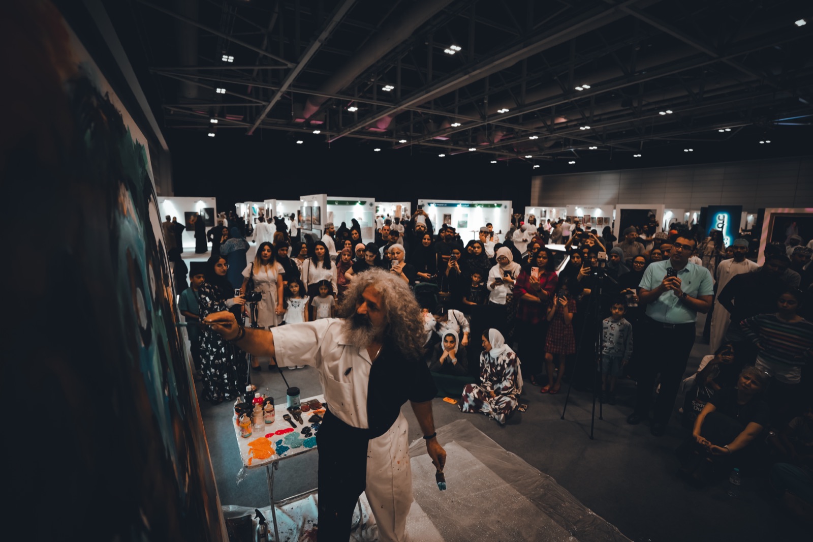 Muscat Art 2025 — visitors with the work